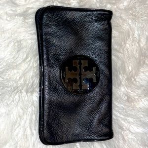 Black Calfskin Tory Burch clutch.